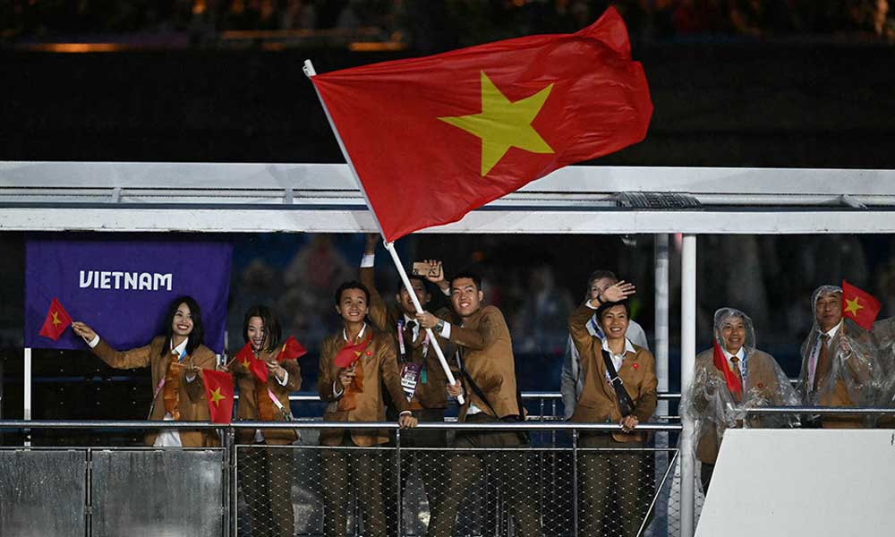 Historic river parade, Dion show-stopper ignite Paris Olympics